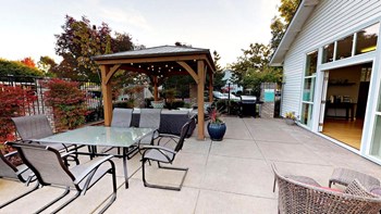 Jenna-Village-Club-House Outdoor Table Area Jenna-Village-Club-House Outdoor Table Area